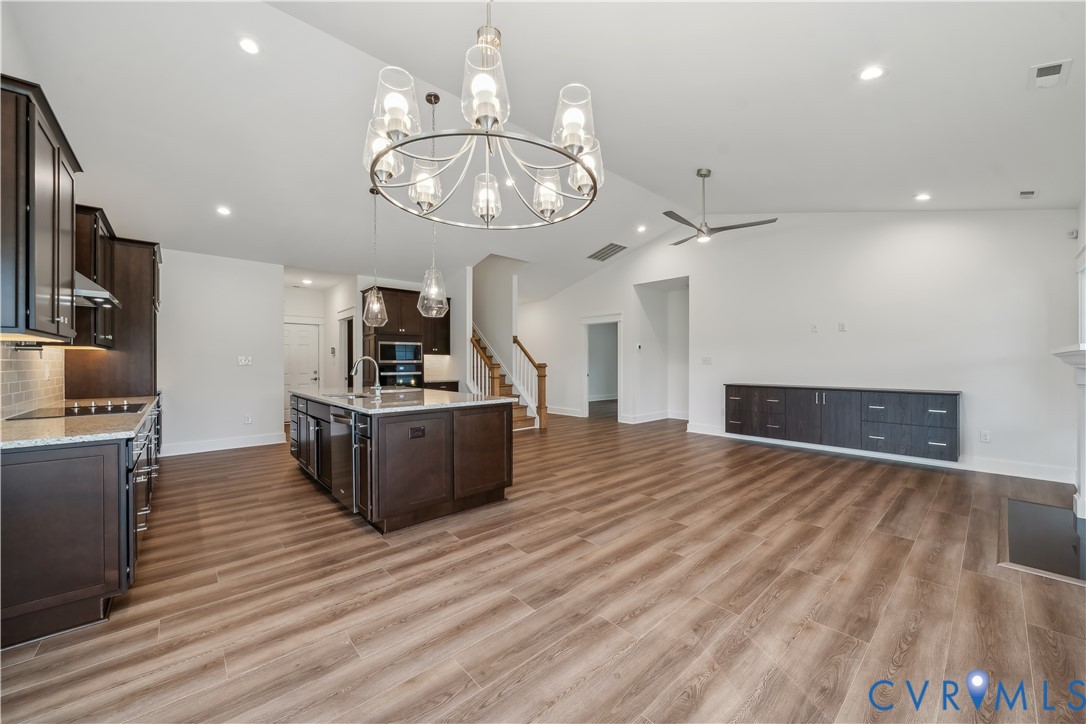 114 Logan Way Tappahannock, VA 22560 - Photo 6 of 28 a large kitchen with stainless steel appliances a large counter top and living room