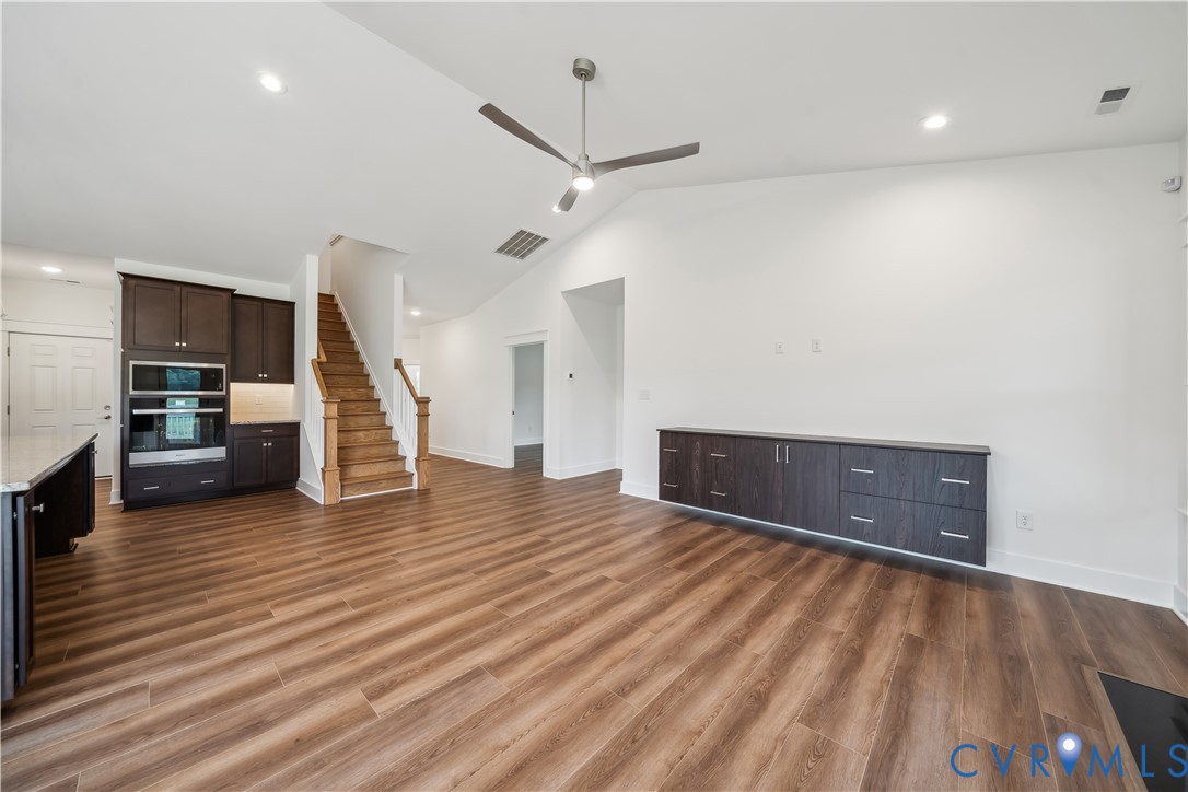 114 Logan Way Tappahannock, VA 22560 - Photo 8 of 28 a view of a livingroom with wooden floor and a ceiling fan