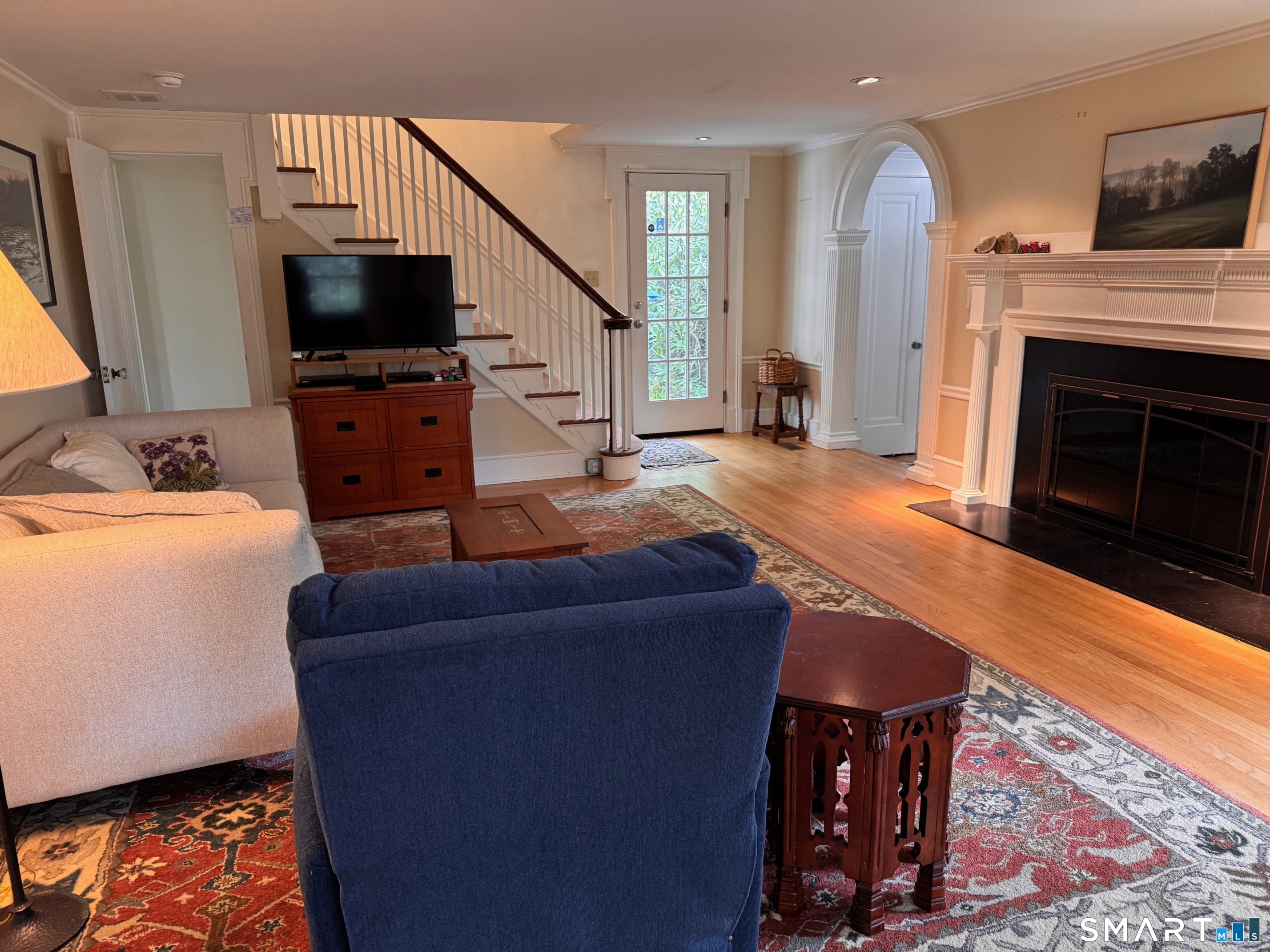 57 Mill Rock Road Hamden, CT 06517 - Photo 2 of 24 a living room with furniture and a flat screen tv