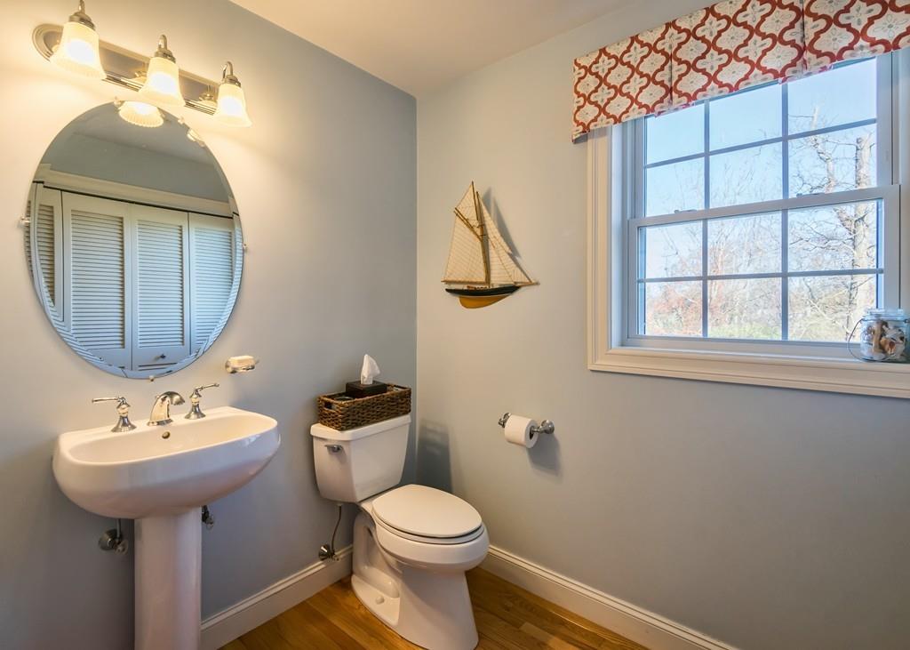 10 Intervale Road Marblehead, MA 01945 - Photo 12 of 32 a bathroom with a toilet sink and mirror