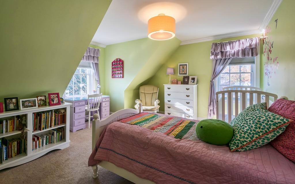 10 Intervale Road Marblehead, MA 01945 - Photo 16 of 32 a bedroom with a bed and a book shelf