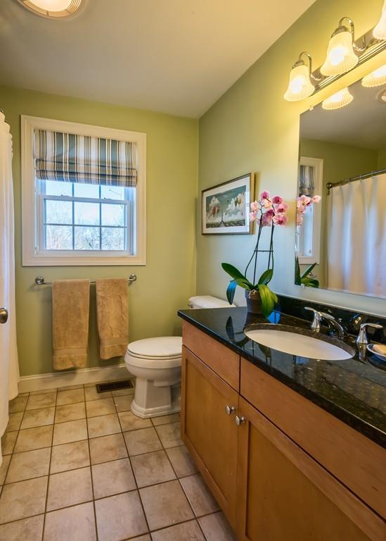 10 Intervale Road Marblehead, MA 01945 - Photo 20 of 32 a bathroom with a granite countertop sink and a mirror