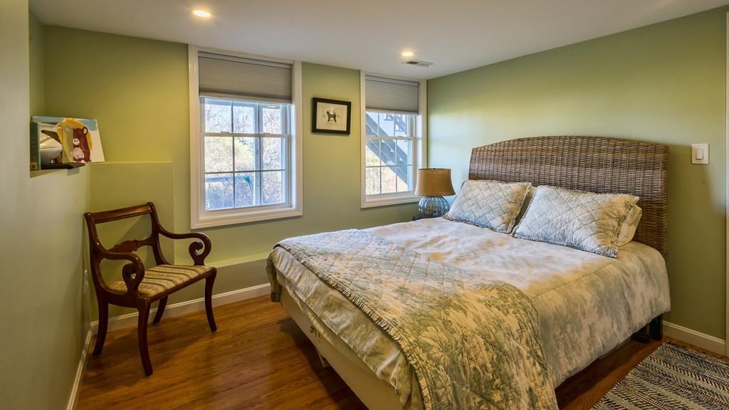 10 Intervale Road Marblehead, MA 01945 - Photo 23 of 32 a bedroom with a bed and wooden floor