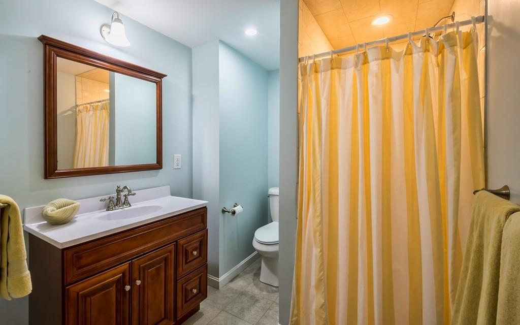 10 Intervale Road Marblehead, MA 01945 - Photo 25 of 32 a bathroom with a double vanity sink toilet and a mirror
