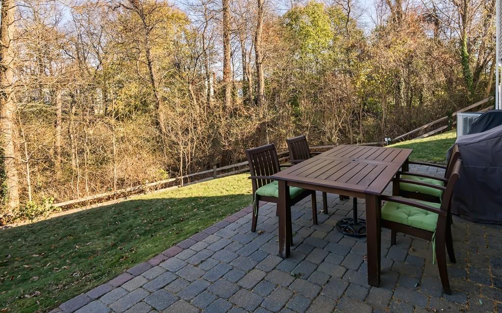 10 Intervale Road Marblehead, MA 01945 - Photo 27 of 32 a view of a patio with table and chairs and wooden fence
