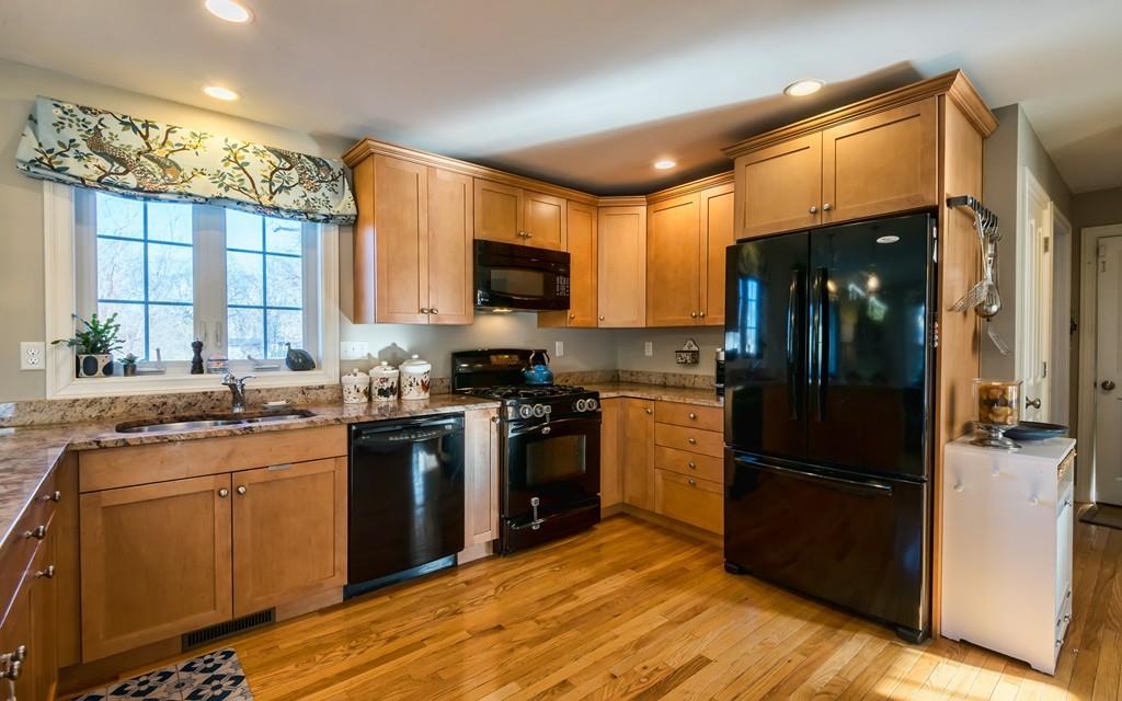 10 Intervale Road Marblehead, MA 01945 - Photo 5 of 32 a kitchen with stainless steel appliances granite countertop a stove a sink dishwasher a refrigerator and a microwave