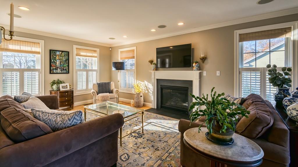10 Intervale Road Marblehead, MA 01945 - Photo 7 of 32 a living room with furniture potted plant and a fireplace