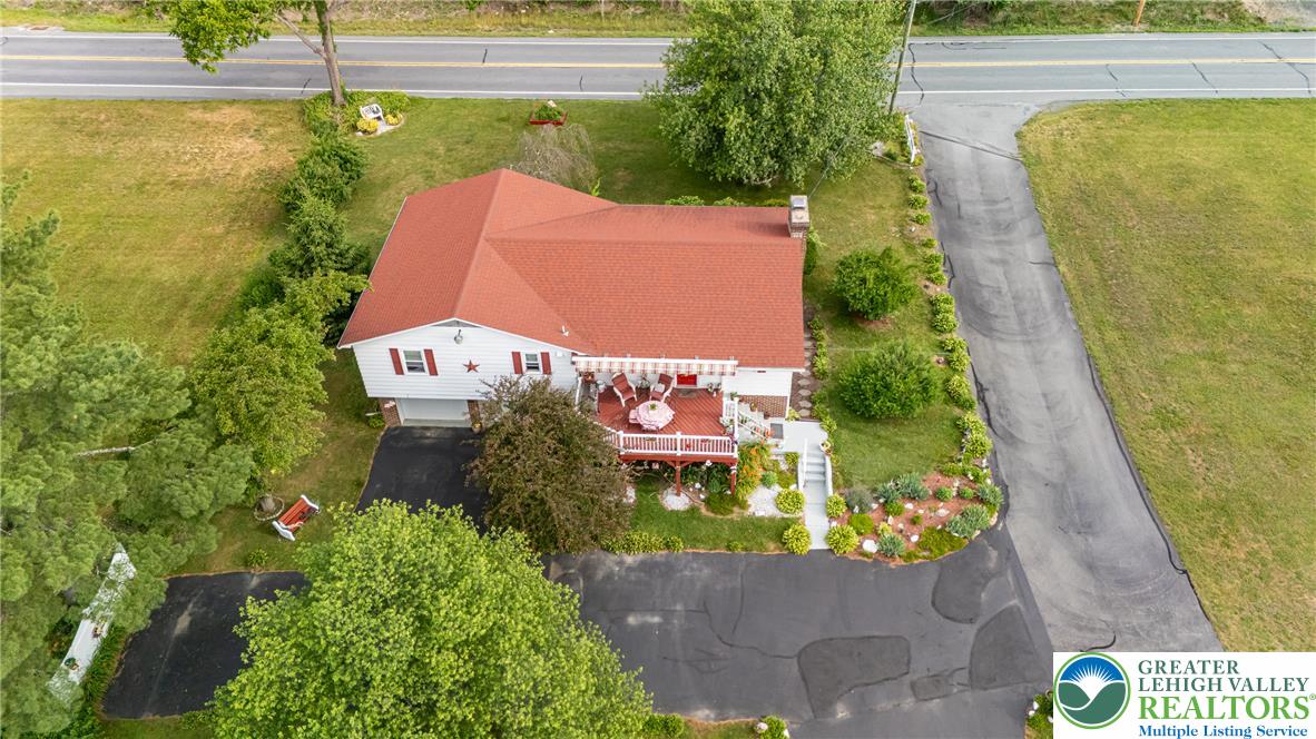 678 Interchange Road Kresgeville, PA 18333 - Photo 3 of 45 An aerial perspective reveals a charming home with a distinctive red roof and ample yard space.