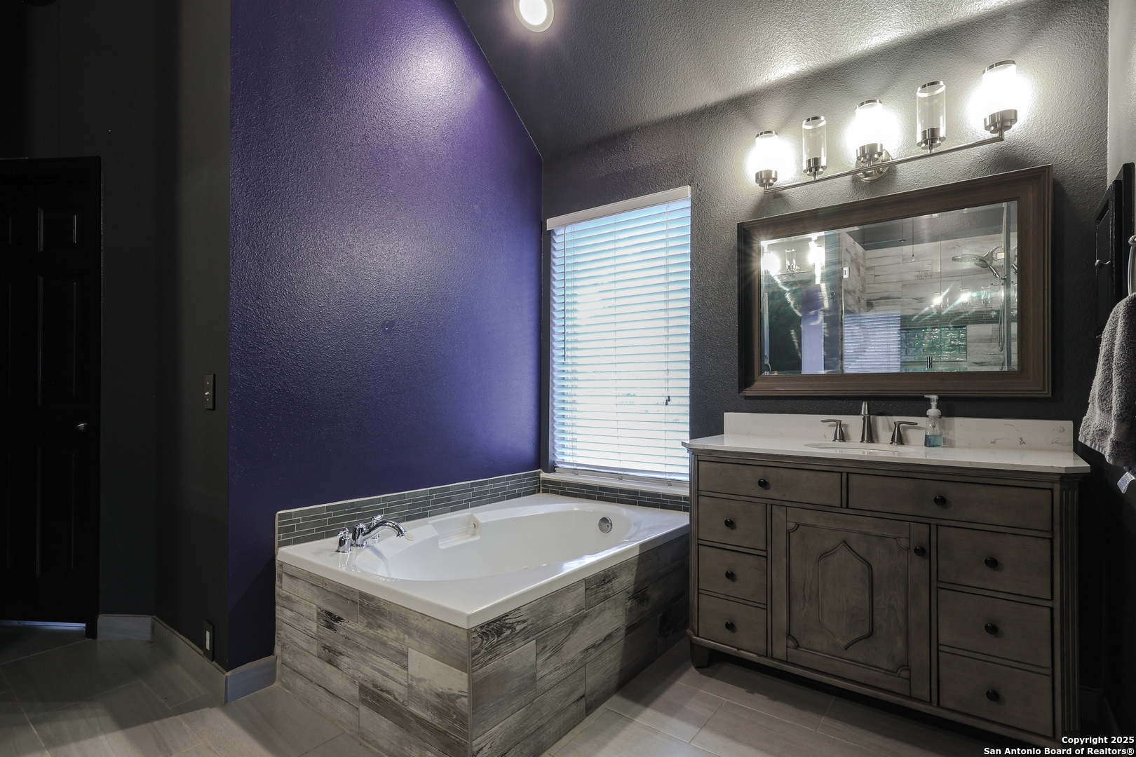 1615 Lookout Point San Antonio, TX 78260 - Photo 20 of 38 a bathroom with a sink double vanity and a mirror