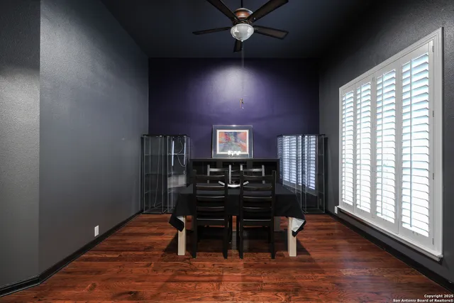 a dining room with furniture and wooden floor