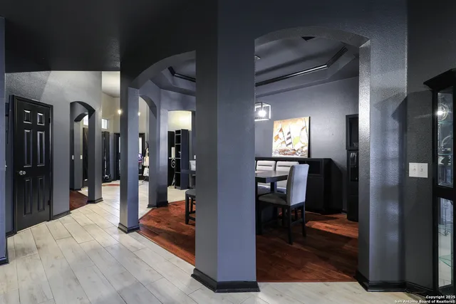 a view of a hallway with living room and furniture