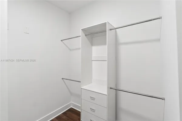 a view of an empty walk in closet