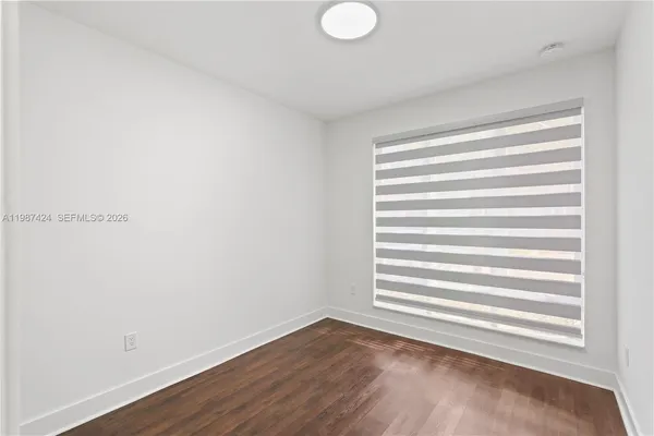 a view of a room that has a window in it