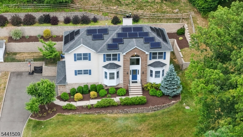 610 River Road Chatham, NJ 07928 - Photo 38 of 42 a aerial view of a house with a yard