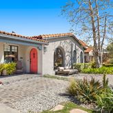 a view of a palm trees in front of a house