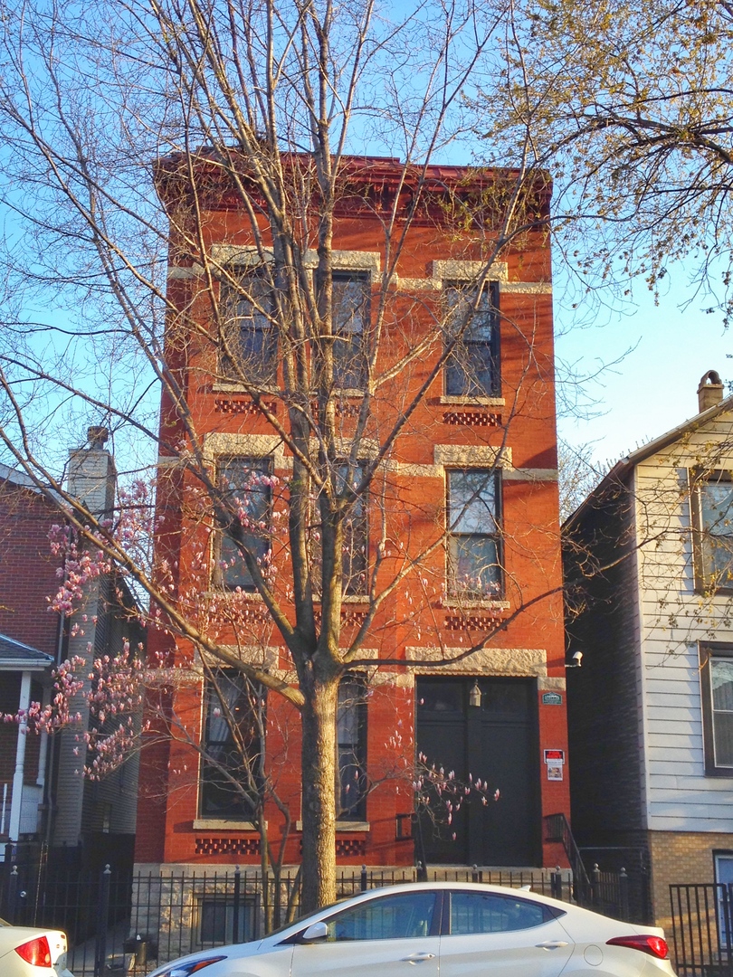 1421 West Huron Street, Unit 2R Chicago, IL 60642 - Photo 1 of 19 a outdoor view of a building with a tree
