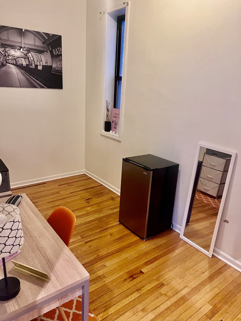 1421 West Huron Street, Unit 2R Chicago, IL 60642 - Photo 12 of 19 a view of a room with wooden floor and lounge chair