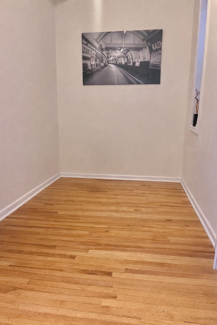 1421 West Huron Street, Unit 2R Chicago, IL 60642 - Photo 14 of 19 a view of wooden floor