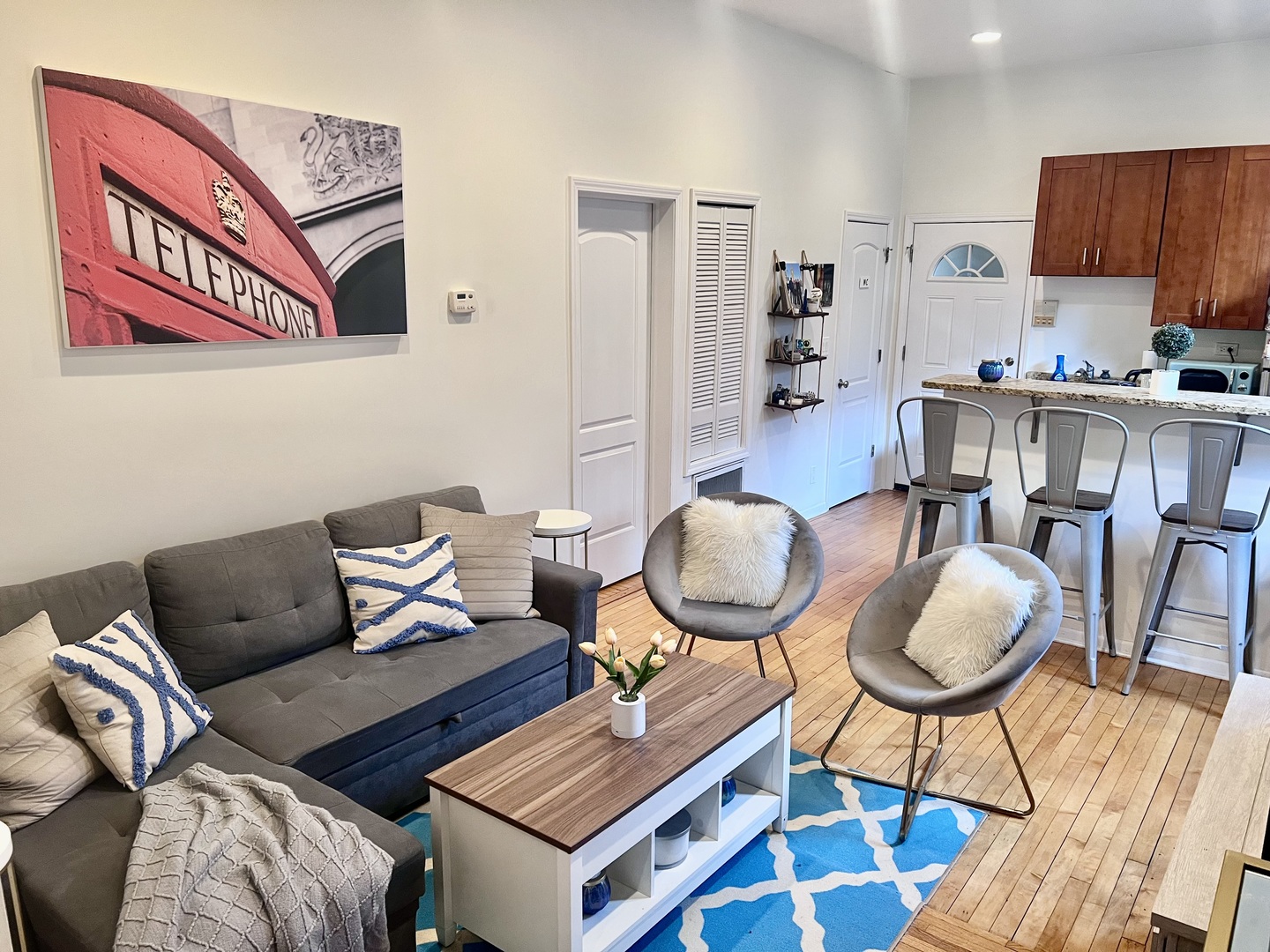 1421 West Huron Street, Unit 2R Chicago, IL 60642 - Photo 3 of 19 a living room with furniture a rug and kitchen view