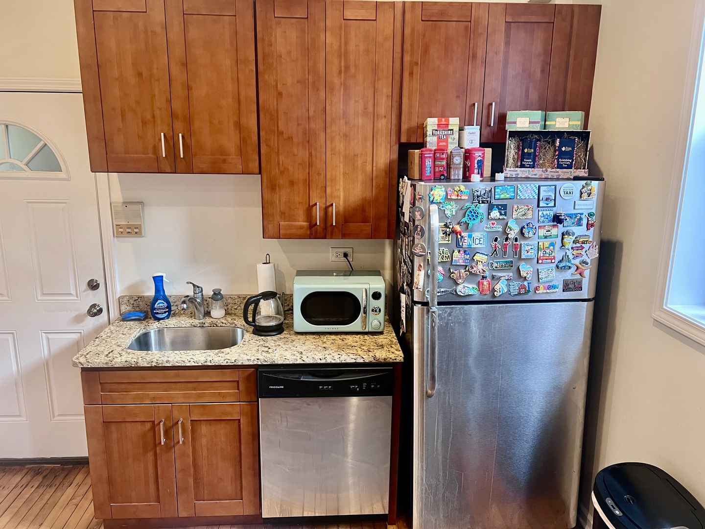 1421 West Huron Street, Unit 2R Chicago, IL 60642 - Photo 8 of 19 a kitchen with stainless steel appliances granite countertop a refrigerator and a stove top oven