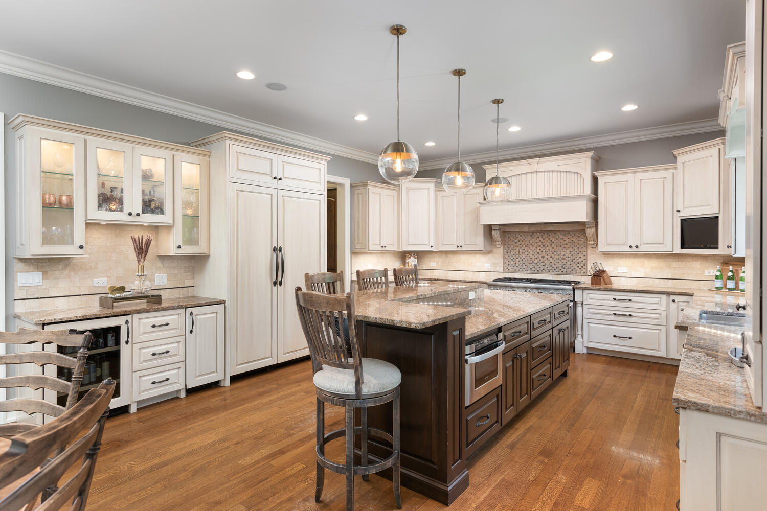 833 Wellner Road Naperville, IL 60540 - Photo 13 of 59 a kitchen with stainless steel appliances granite countertop a stove a sink dishwasher a refrigerator and white cabinets with wooden floor