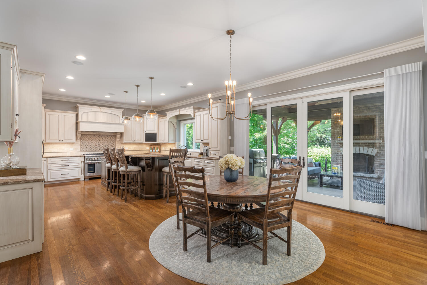 833 Wellner Road Naperville, IL 60540 - Photo 15 of 59 a dining room with furniture window and wooden floor