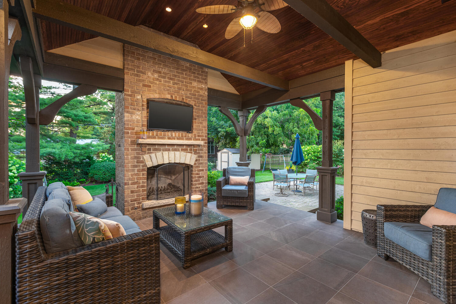 833 Wellner Road Naperville, IL 60540 - Photo 16 of 59 a living room with furniture a fireplace and a flat screen tv