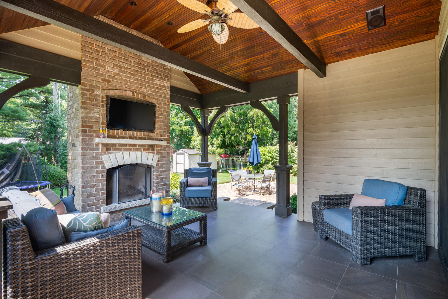 833 Wellner Road Naperville, IL 60540 - Photo 18 of 59 a living room with furniture a fireplace and a floor to ceiling window