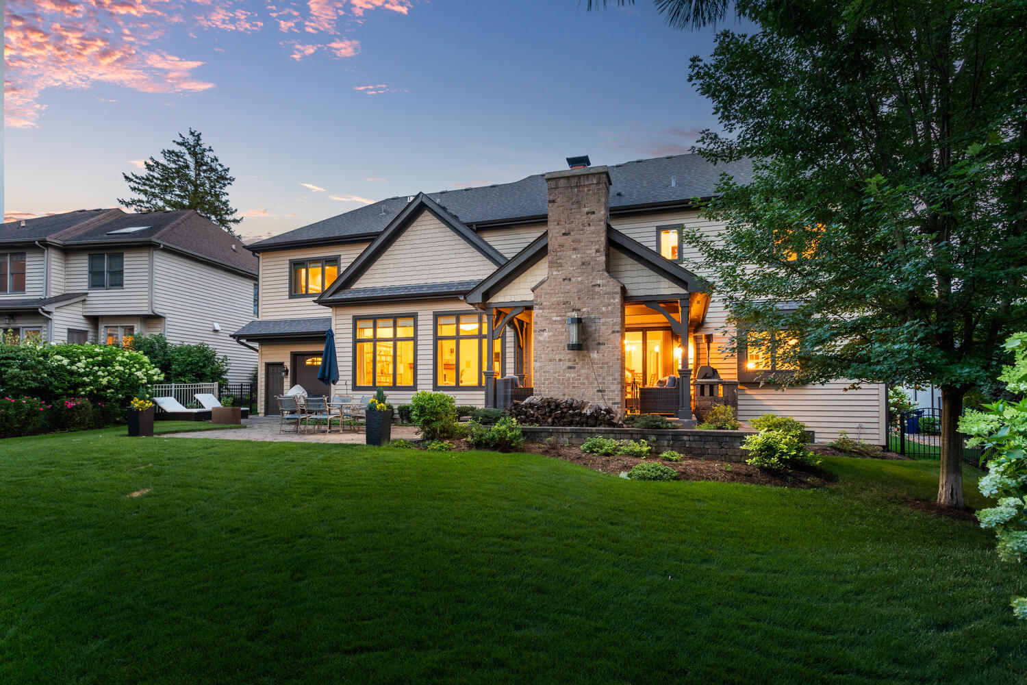 833 Wellner Road Naperville, IL 60540 - Photo 2 of 59 a front view of a house with a garden and plants