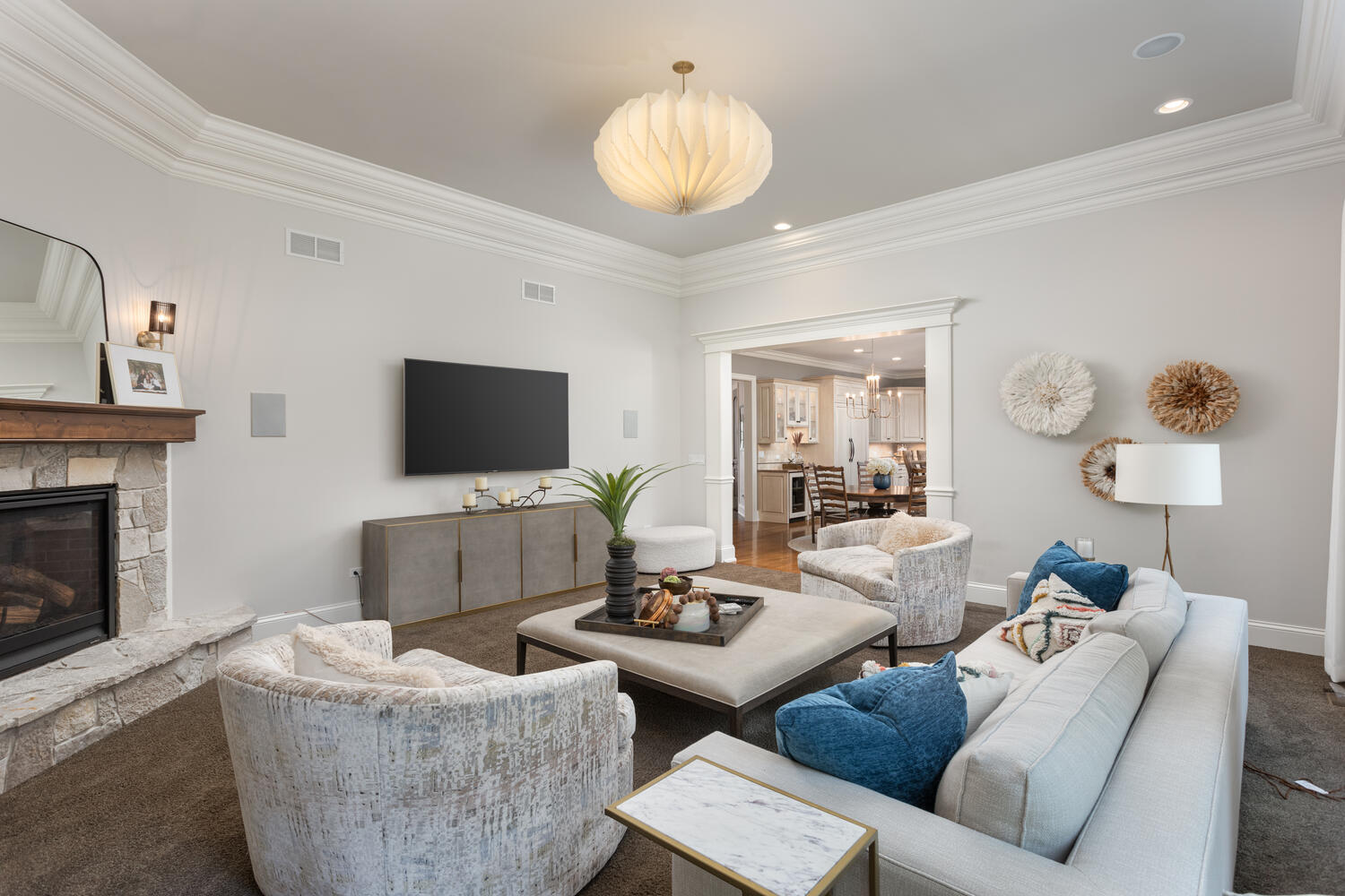 833 Wellner Road Naperville, IL 60540 - Photo 23 of 59 a living room with couches a fireplace and a flat screen tv