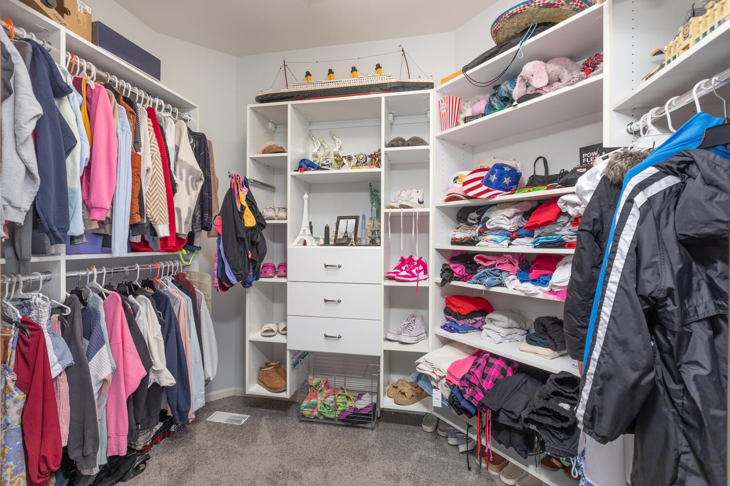 833 Wellner Road Naperville, IL 60540 - Photo 40 of 59 a view of walk in closet with clothes and shoes