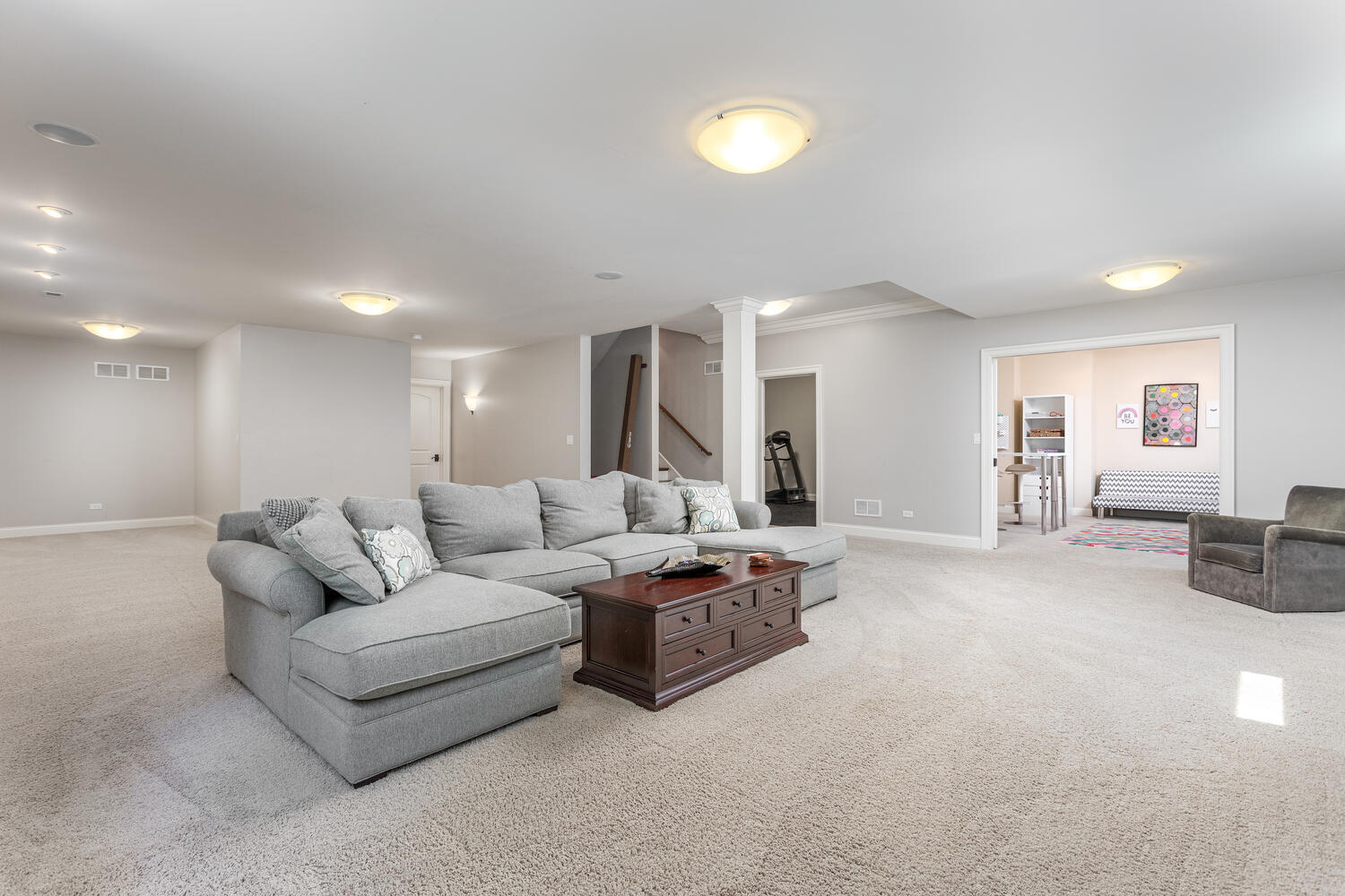 833 Wellner Road Naperville, IL 60540 - Photo 48 of 59 a living room with furniture and a table