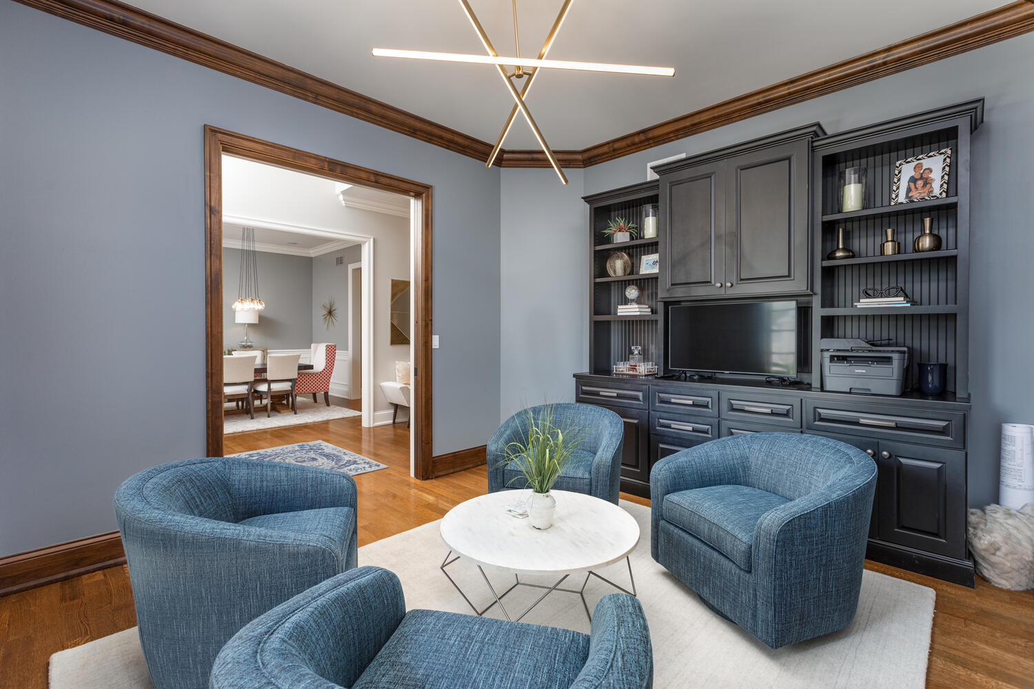 833 Wellner Road Naperville, IL 60540 - Photo 6 of 59 a living room with furniture a flat screen tv and kitchen view