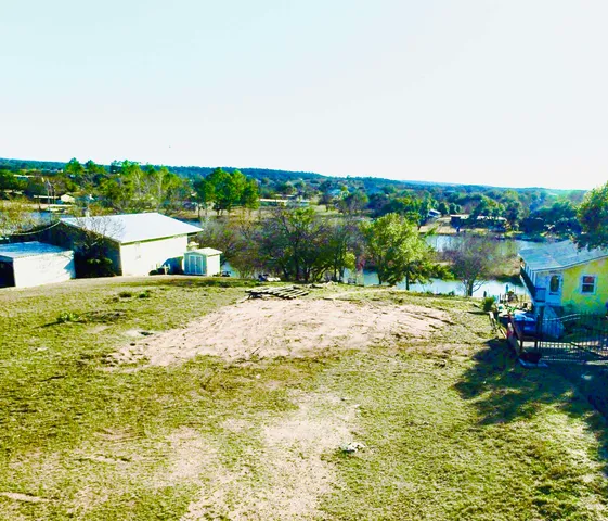 a view of a lake with a yard