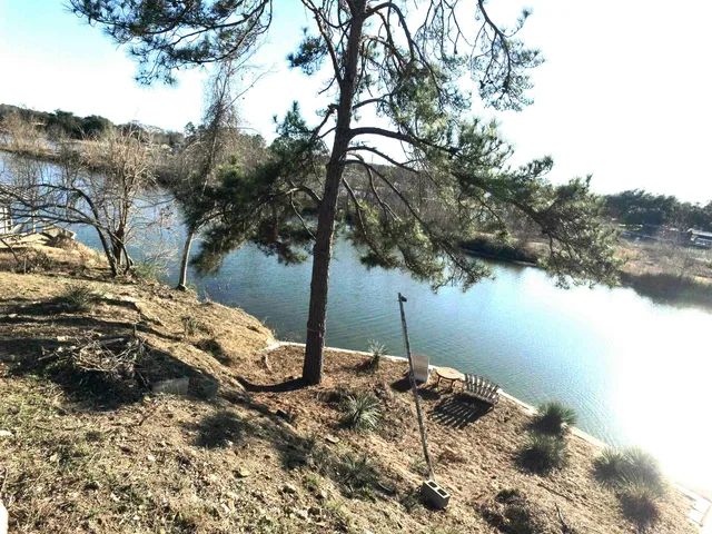 a view of a backyard of the house
