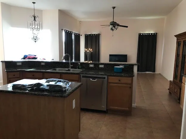 a kitchen with a sink and a refrigerator