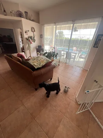 a view of a dining room with furniture and window