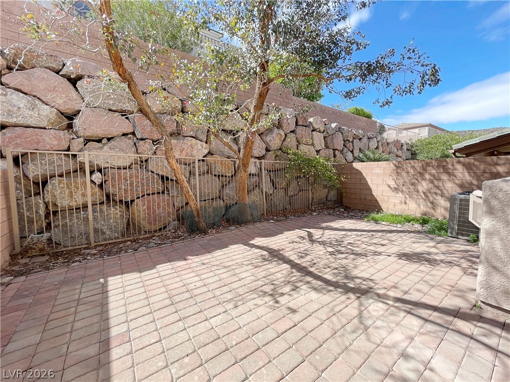 691 Principle Point Avenue Henderson, NV 89012 - Photo 30 of 30 A private paved courtyard provides a serene outdoor retreat.