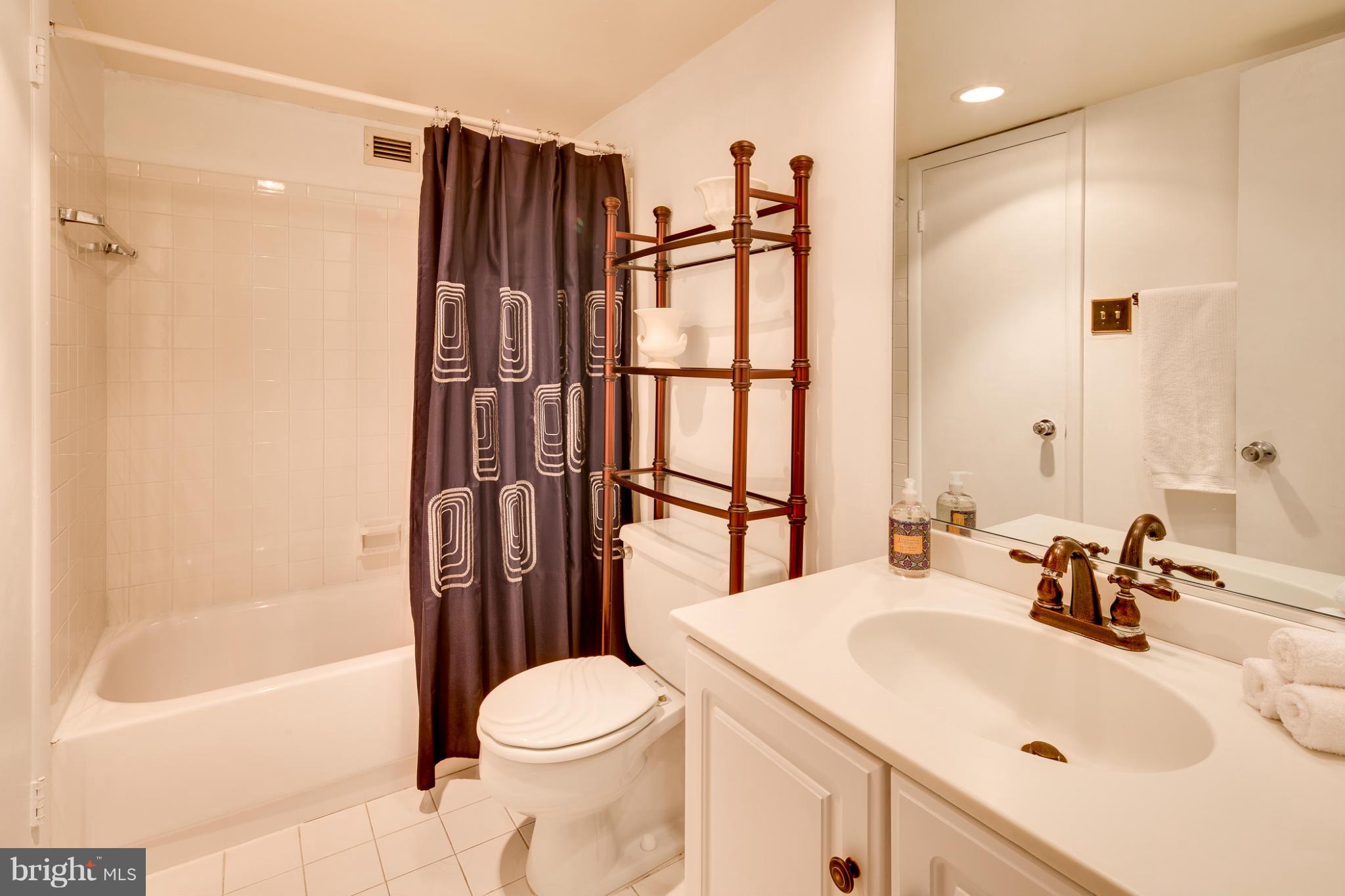 1301 20th Street Northwest, Unit 117 Washington, DC 20036 - Photo 10 of 16 a bathroom with a sink toilet and shower