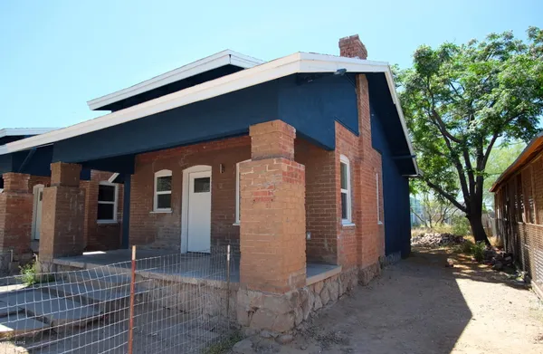 a front view of a house with parking space