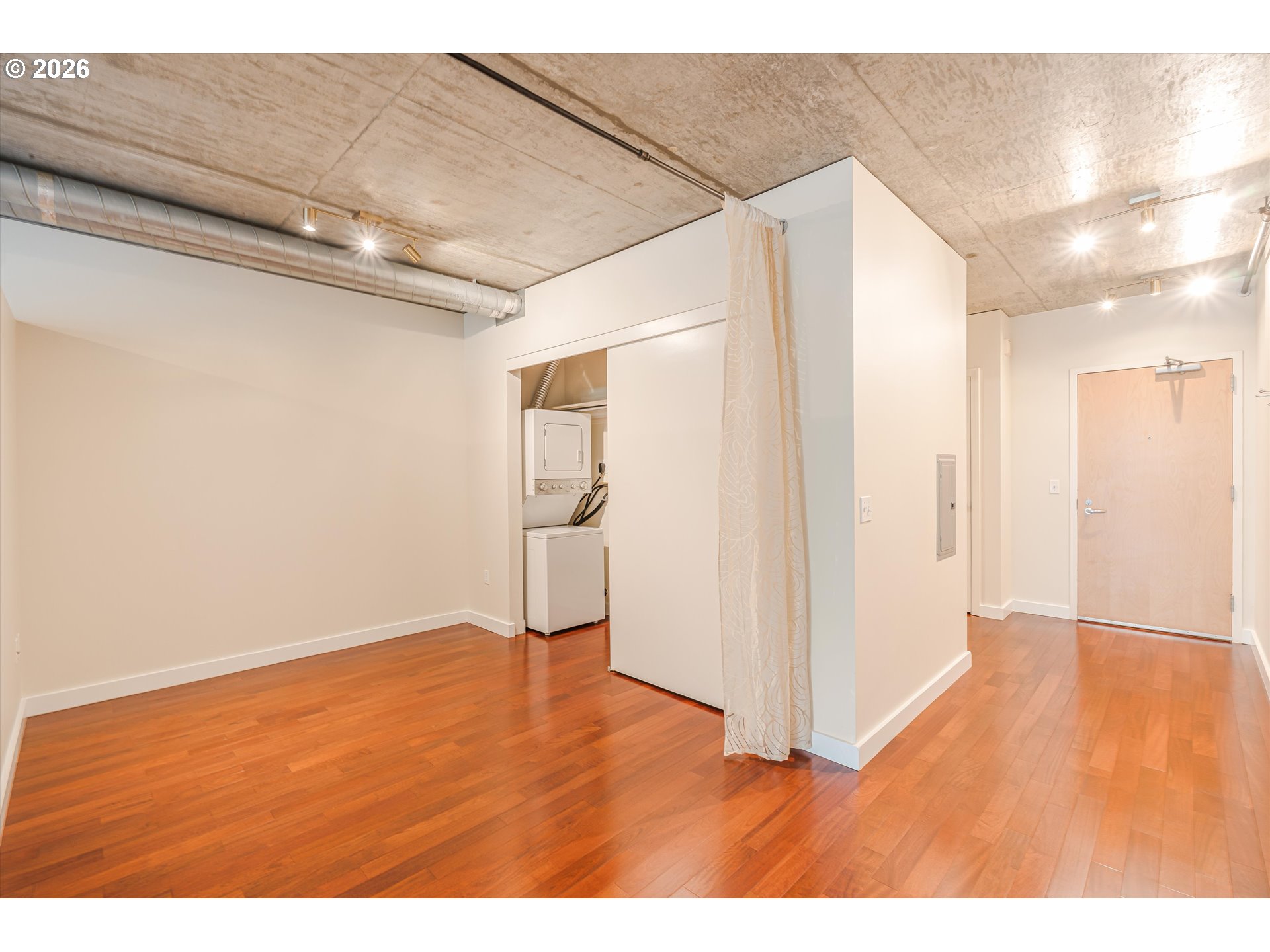 1926 West Burnside Street, Unit 512 Portland, OR 97209 - Photo 14 of 18 a view of empty room with wooden floor