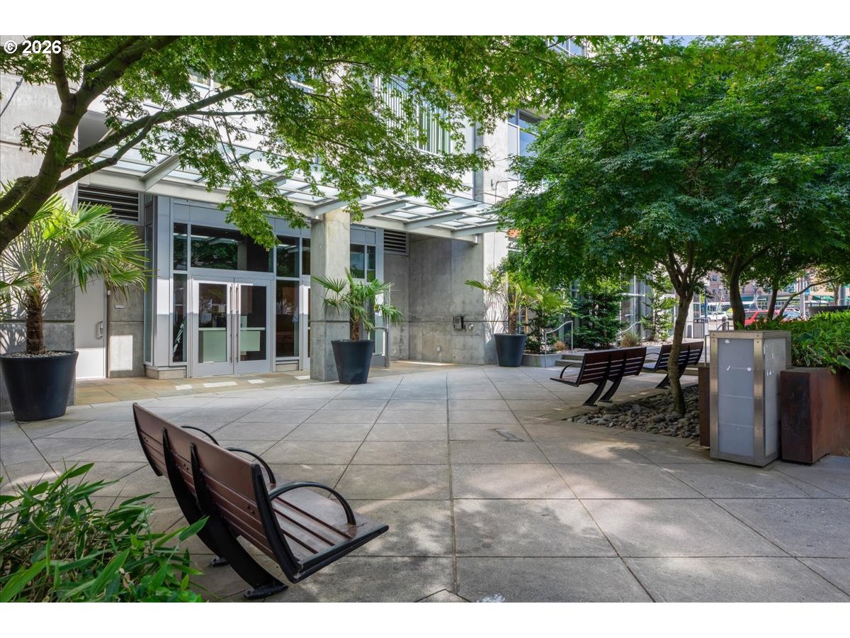1926 West Burnside Street, Unit 512 Portland, OR 97209 - Photo 18 of 18 a view of a patio with table and chairs and potted plants