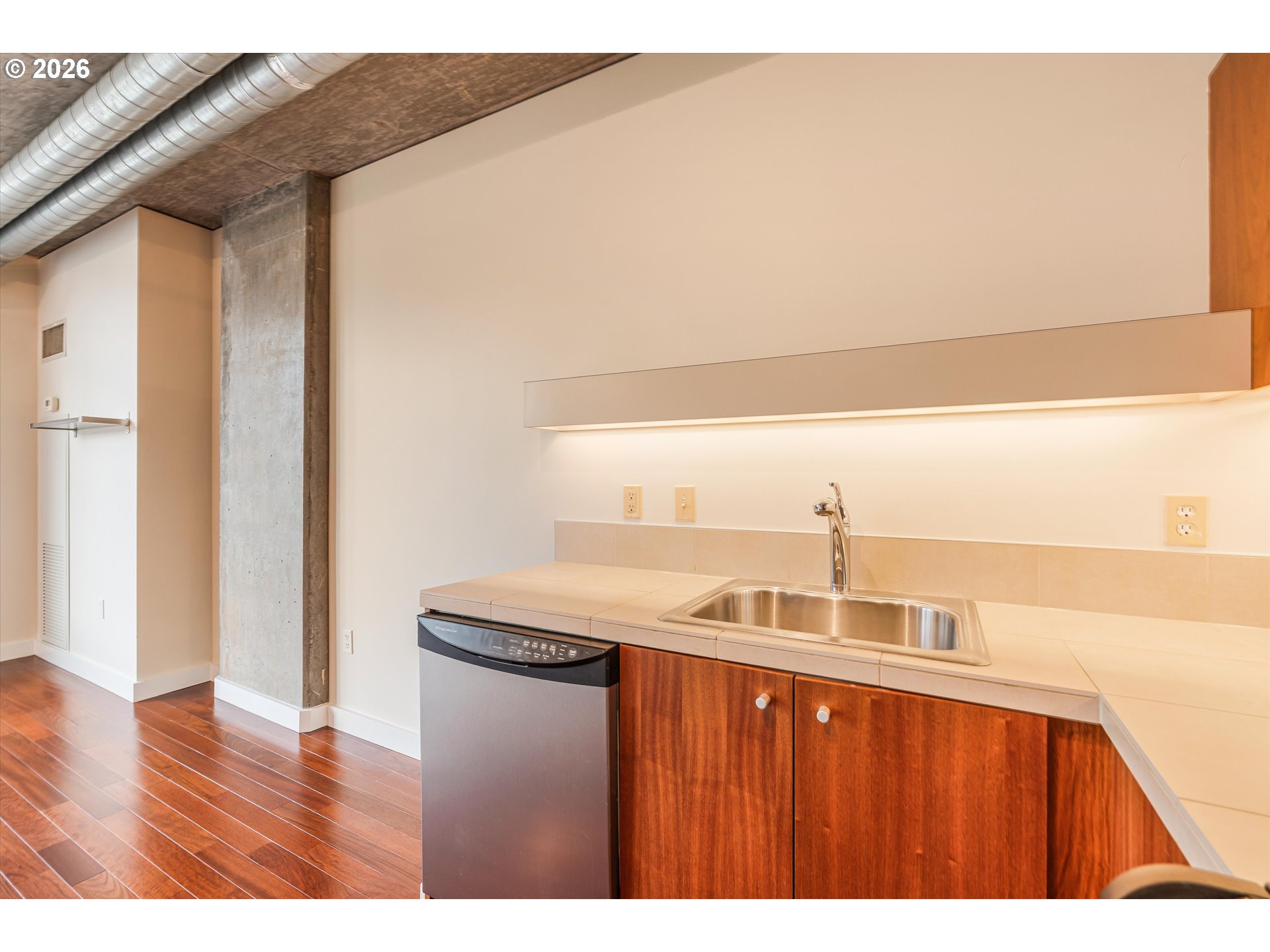 1926 West Burnside Street, Unit 512 Portland, OR 97209 - Photo 10 of 18 a view of a kitchen from the hallway