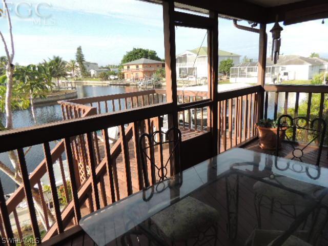 3197 Stabile Road St. James City, FL 33956 - Photo 13 of 17 a view of a city from a balcony with furniture