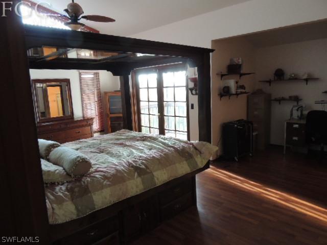 3197 Stabile Road St. James City, FL 33956 - Photo 16 of 17 a bed sitting in a bedroom next to a window
