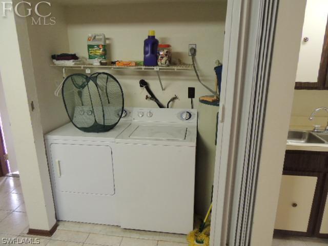 3197 Stabile Road St. James City, FL 33956 - Photo 6 of 17 a utility room with dryer and washer