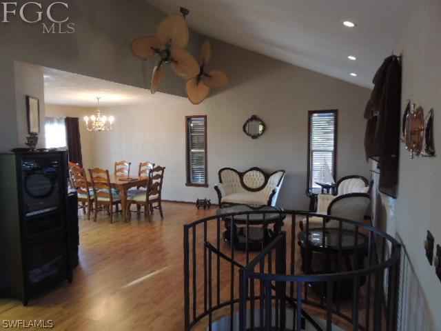 3197 Stabile Road St. James City, FL 33956 - Photo 7 of 17 a view of a dining room with furniture and a chandelier