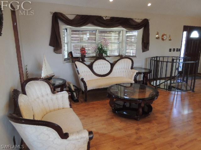 3197 Stabile Road St. James City, FL 33956 - Photo 8 of 17 a living room with furniture a window and kitchen view