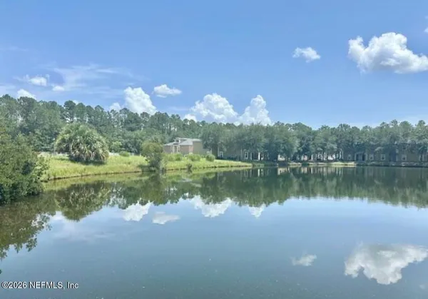 a view of a lake in between two of people