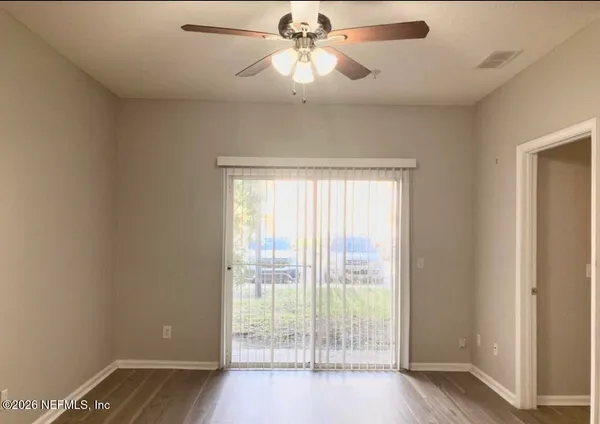 a view of an empty room with a window
